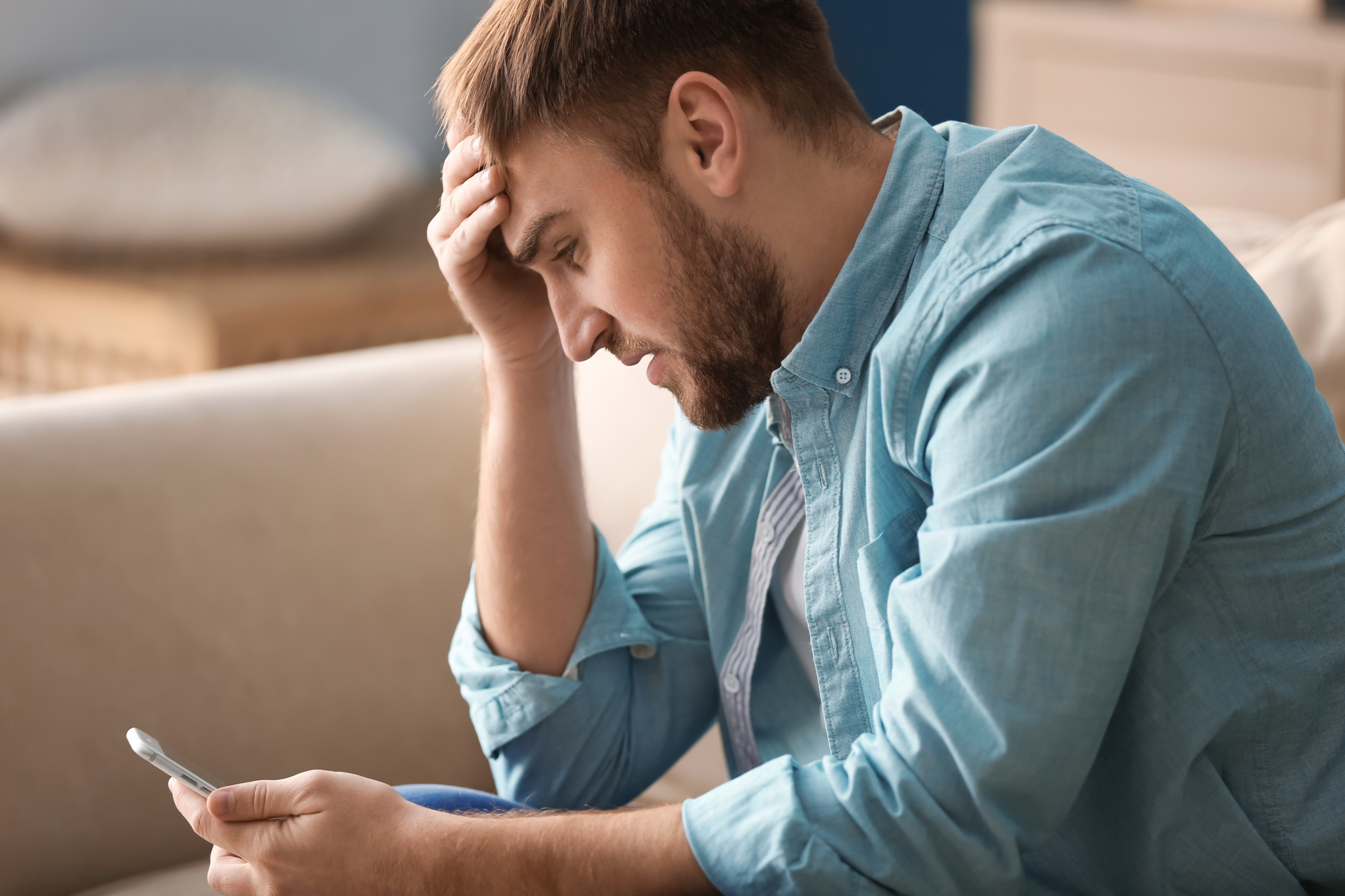 upset man making phone call