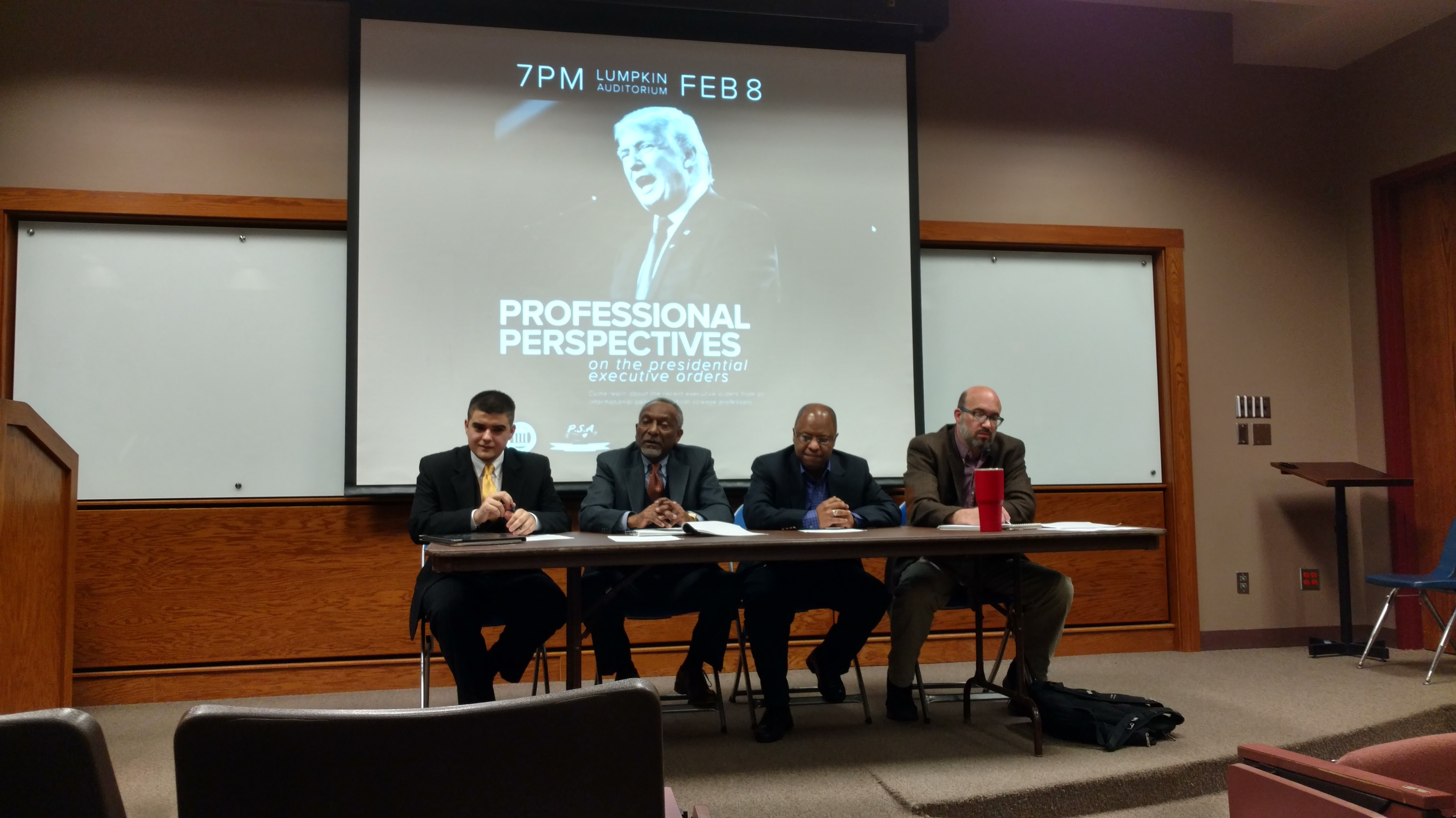 Graduate Student Jack Cruikshank, Professor Anderson, Professor Abebe (Economics) and Professor Murley (Journalism)