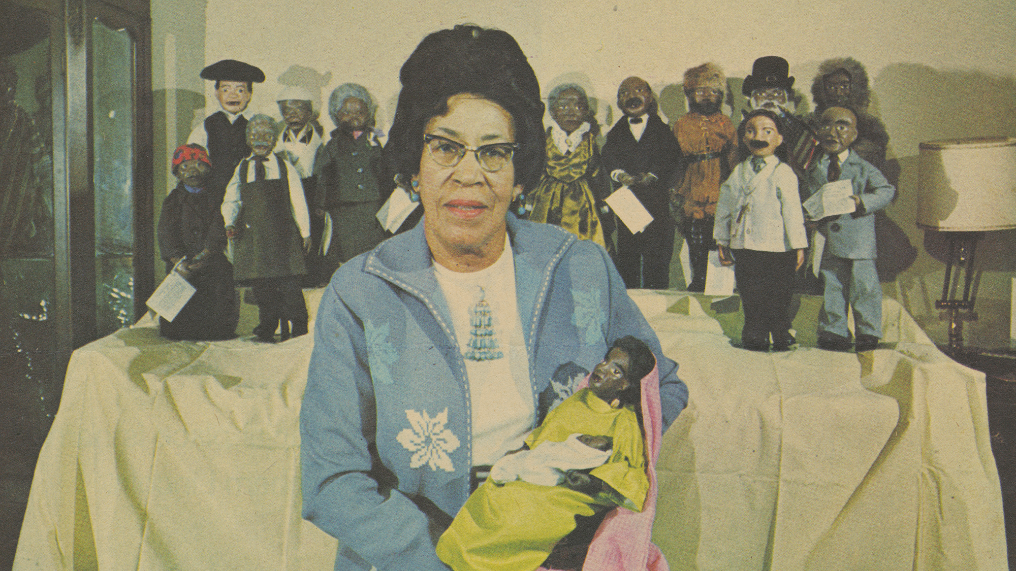 Ida Roberta Bell posing with her dolls